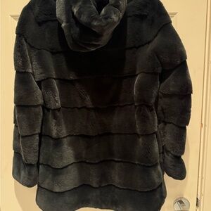 Beautiful dark green mink jacket with hood by Saga Furs.